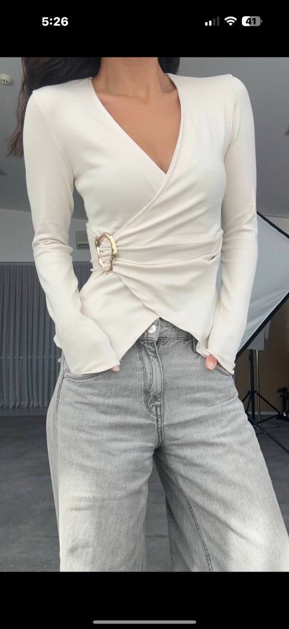 e687f268-263f-4f89-afa9-f3db6f95ea57 Off white long-sleeve wrap top - Image 1