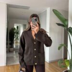 Brown cardigan with gold buttons and front pockets