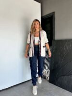 Cream knit cardigan with striped trim and front pockets