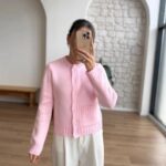 Pink knit cardigan with cable details