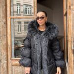 Black puffer jacket with fur collar
