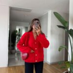 Red cardigan with gold buttons and front pockets