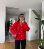 Red cardigan with gold buttons and front pockets