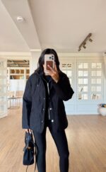 Black quilted jacket with a black lined-hood