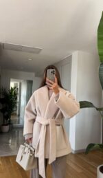 Ecru belted coat with a wide open collar