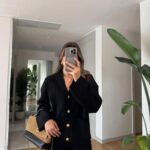 Black cardigan with gold buttons and front pockets