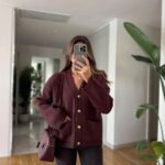 Burgundy cardigan with gold buttons and front pockets