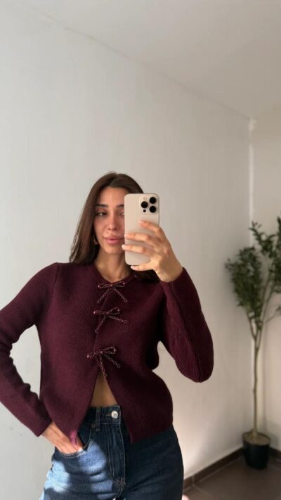 Burgundy knit cardigan with beaded bow closures