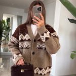 oversized cardigan with geometric patterns in warm brown tones