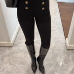 Black leggings with gold buttons