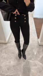 Black leggings with gold buttons