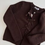 Brown knit cardigan with beaded bow closures - Image 2