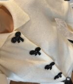 Cream knit cardigan with black bow buttons - Image 2