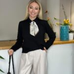 Black top with patterned neck scarf