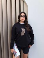 Oversized black sweatshirt with leopard cat print