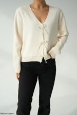 Off white top with beaded bow buttons