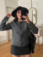 Grey knit cardigan with beaded bow buttons