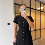 Black dress with gold buttons